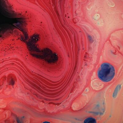 a close up of a red and blue fluid substance