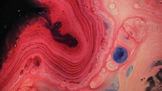 a close up of a red and blue fluid substance